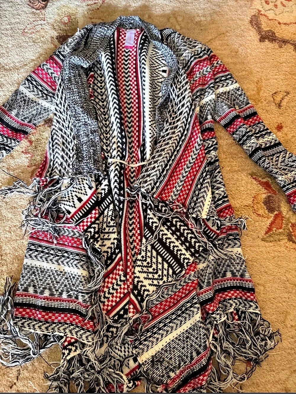 No Boundaries Women's Patterned Fringe Cape in Black & Red cardigan top.